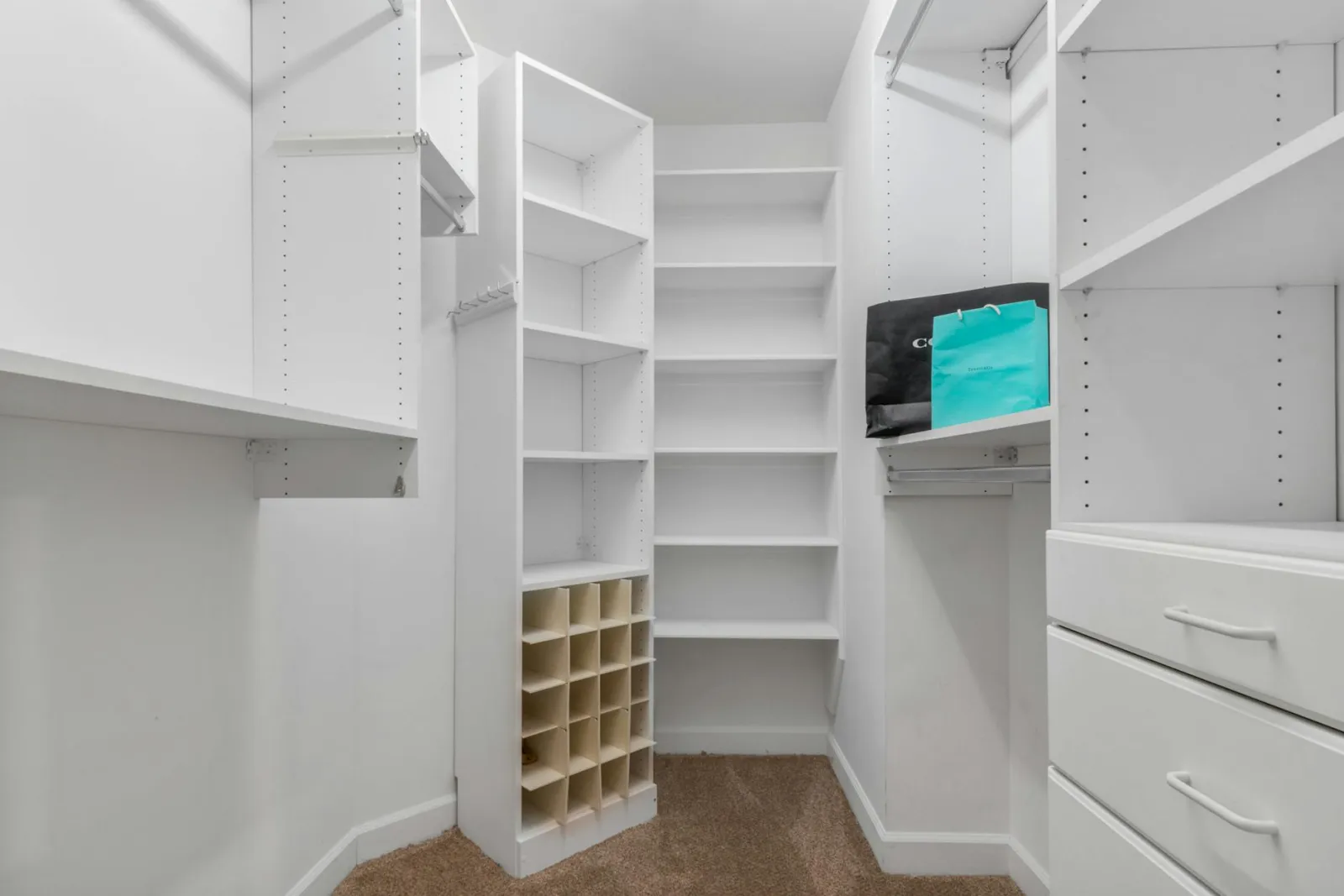 Built-in closet organizer system replacing wire shelving