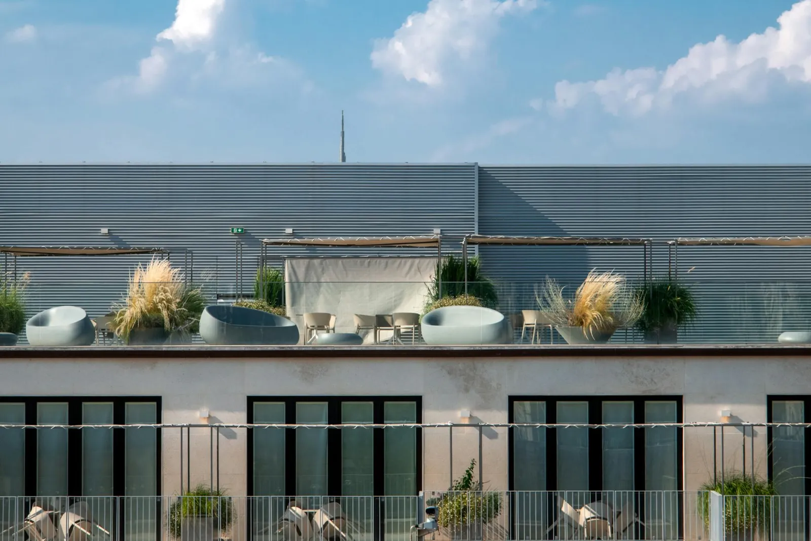 Staged condo balcony with outdoor furniture and plants