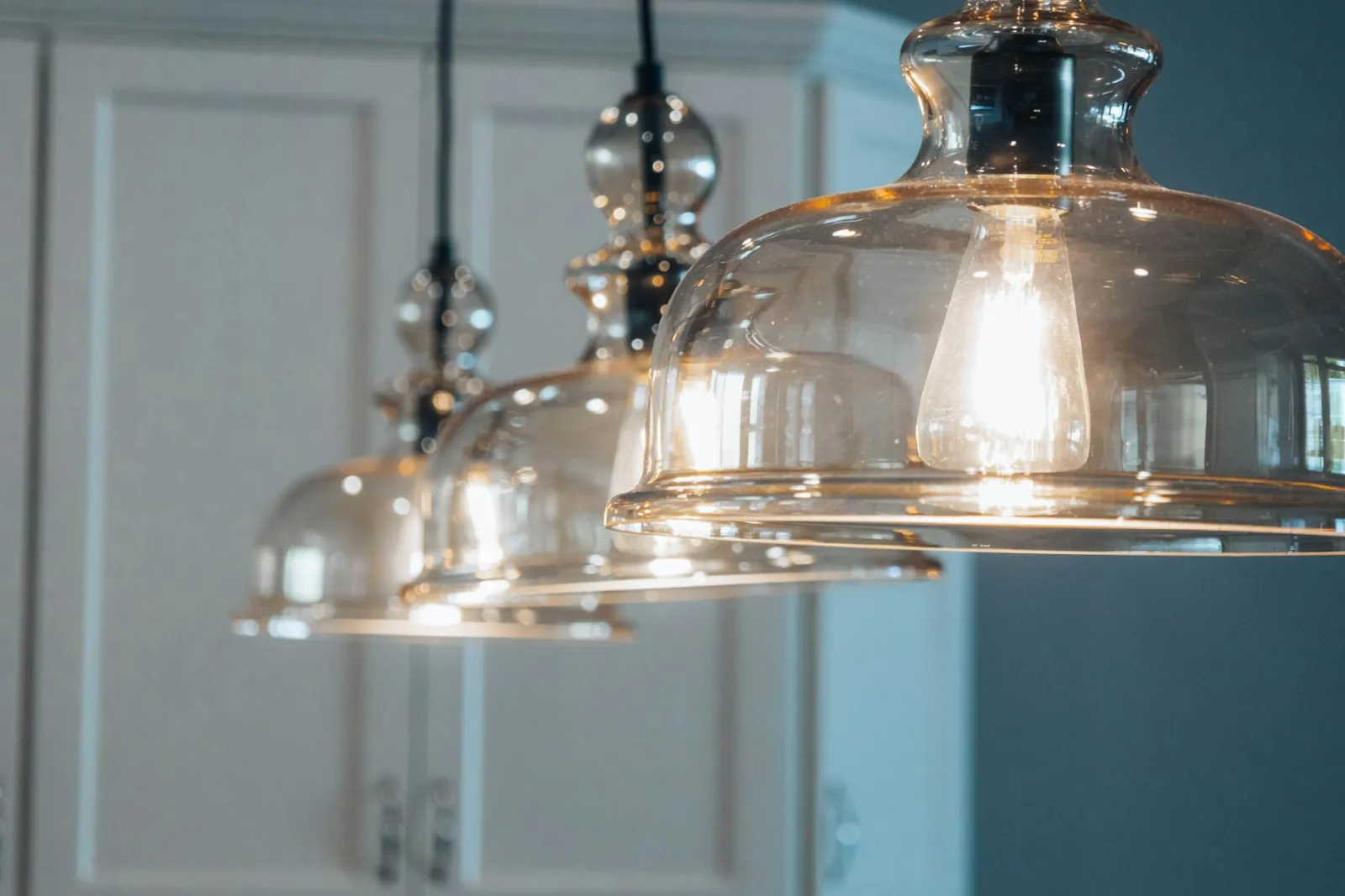 Modern pendant lighting in updated condo kitchen