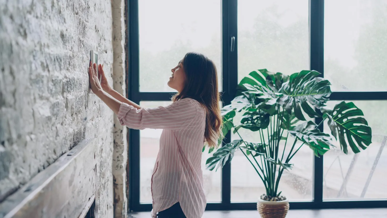 Smart thermostat installed in a modern condo