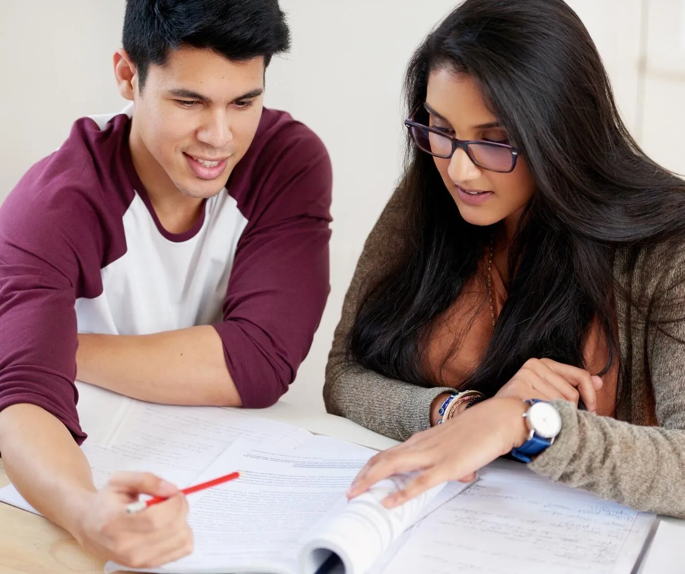 Couple reviewing home purchase documents and mortgage paperwork
