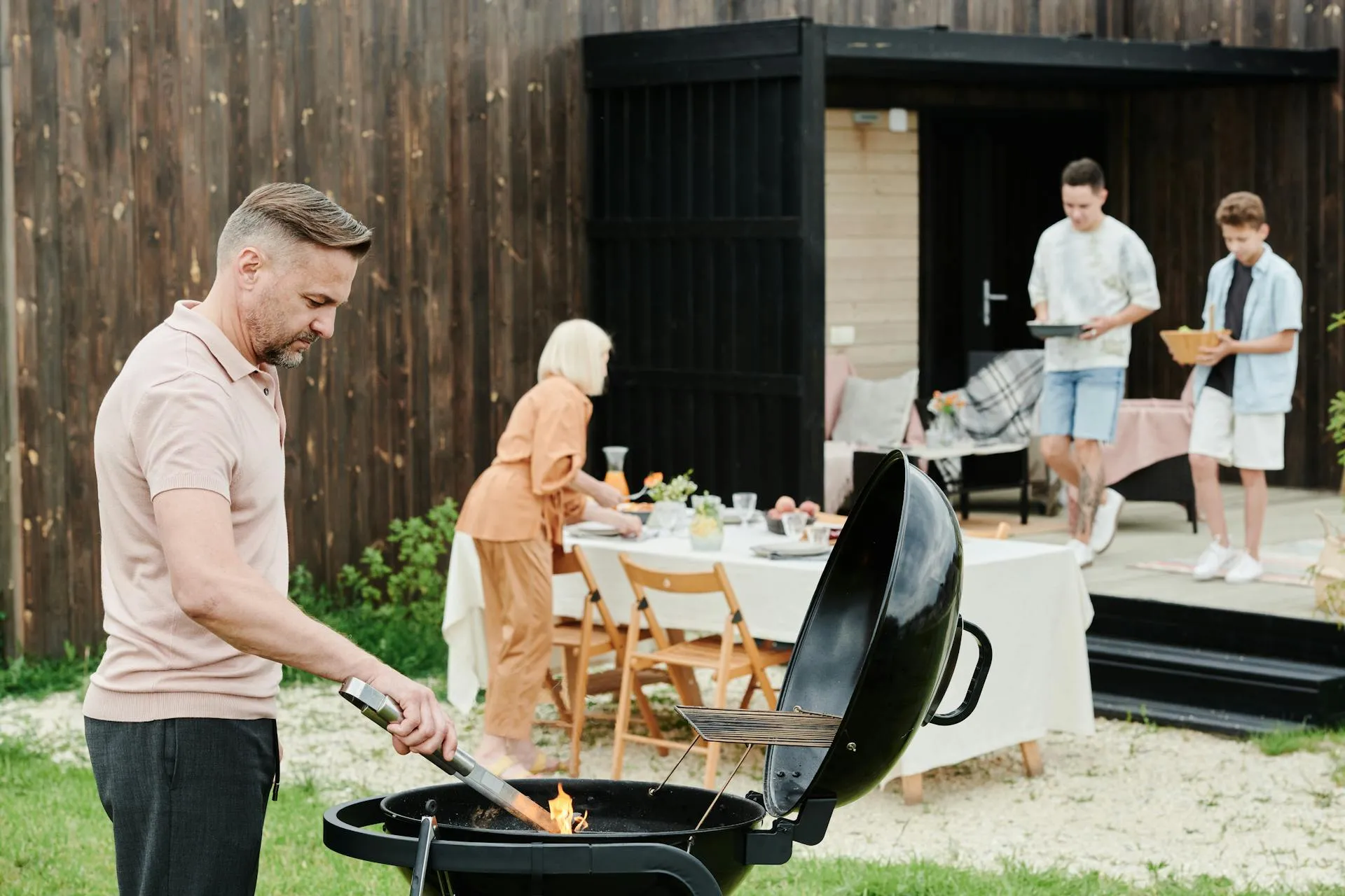Family enjoying backyard BBQ