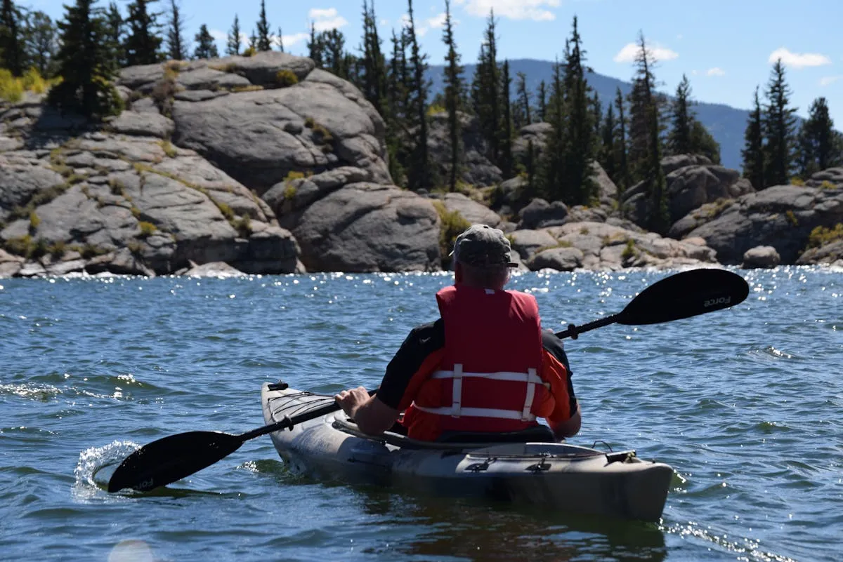 Kayaking on Okanagan Lake on a summer afternoon near a Kelowna lakefront home