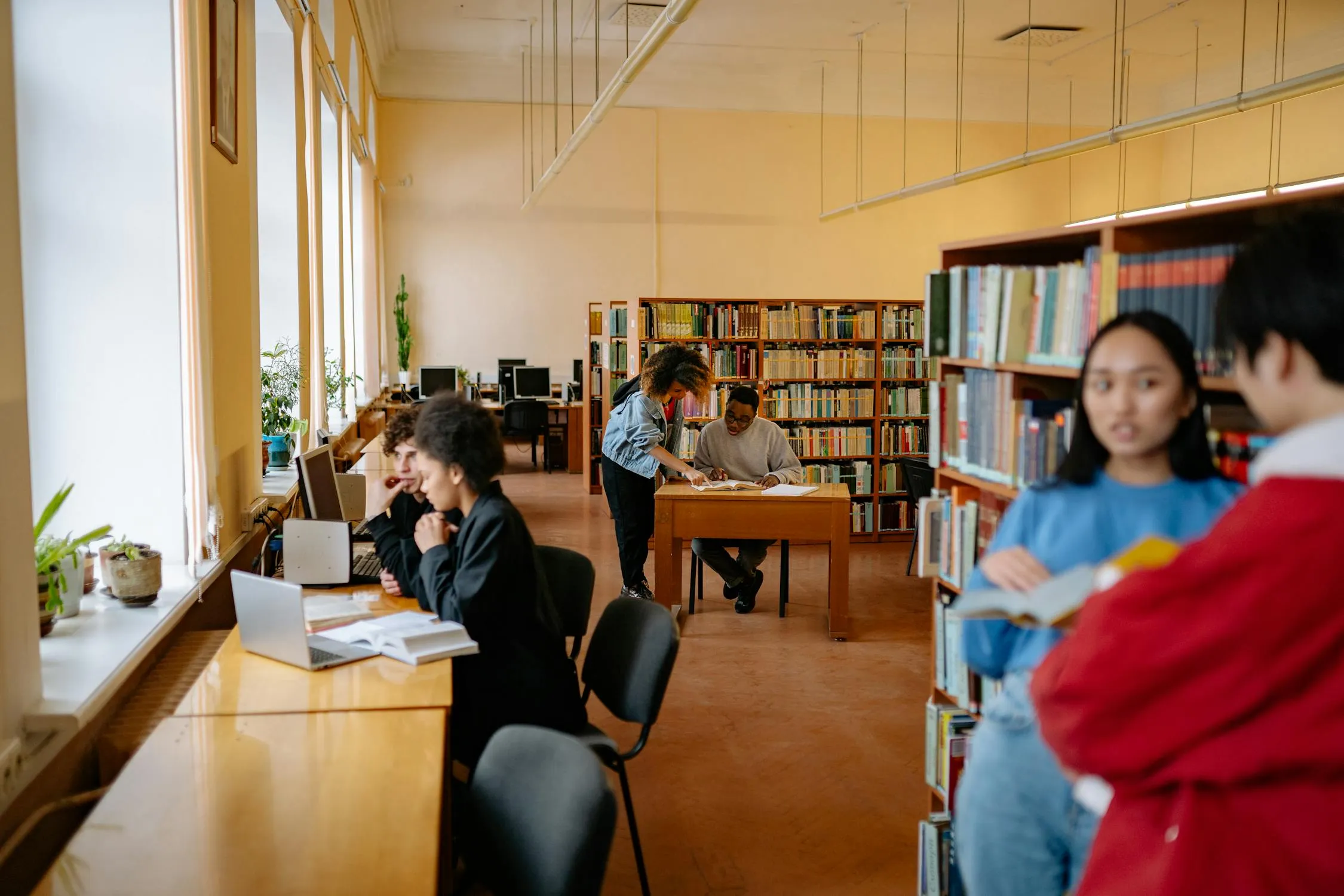 University students studying together in a library near UBCO Kelowna