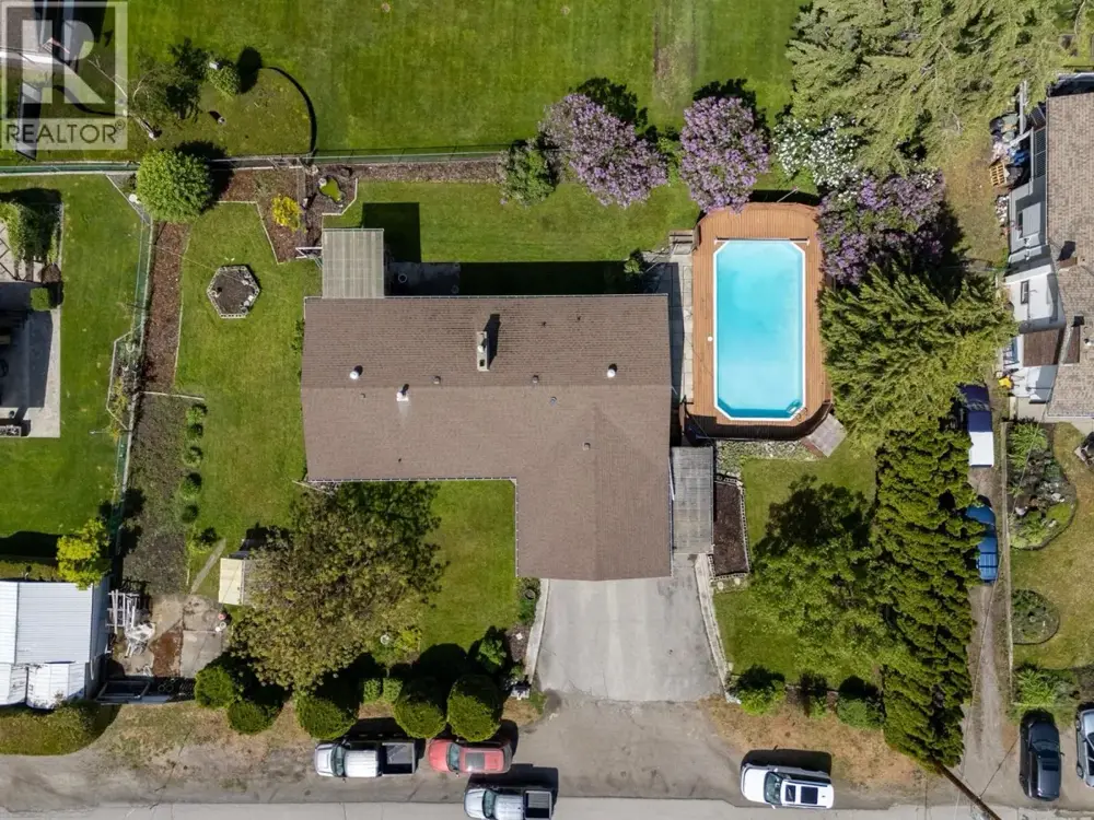 350 Clarissa Road aerial view showing large .34 acre lot with pool and mature landscaping