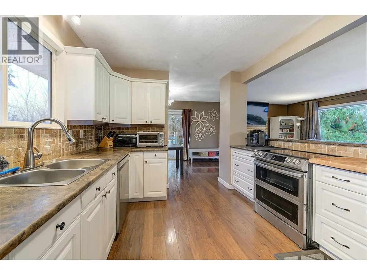 964 Tronson Drive kitchen with white cabinets and stainless steel appliances