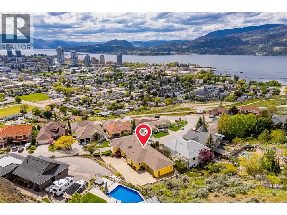 647 Royal Pine Drive aerial view showing Knox Mountain hillside location above downtown Kelowna