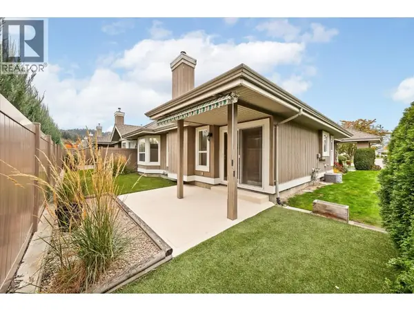 680 Valley Road Unit 12 covered back patio with landscaped yard
