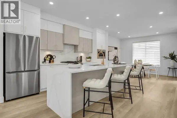 Parallel 4 townhome kitchen with two-tone cabinetry, large island and bar seating