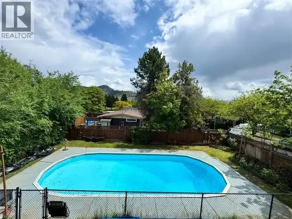 964 Tronson Drive fenced backyard with inground pool and mountain views