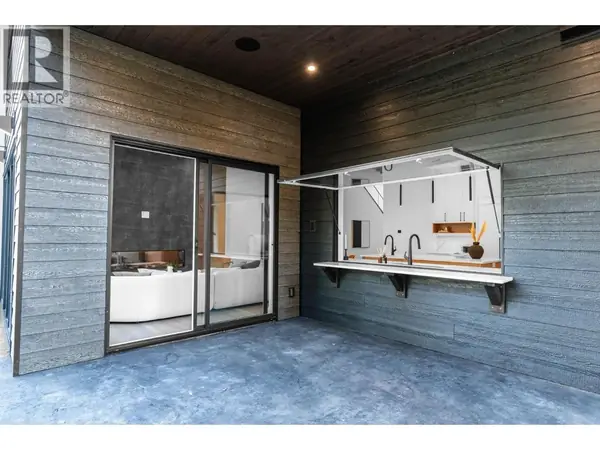 4630 McClure Road covered patio with pass-through kitchen window for outdoor entertaining